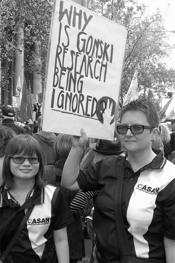 ASAN AUNZ Board members protesting at march in March, 2014.